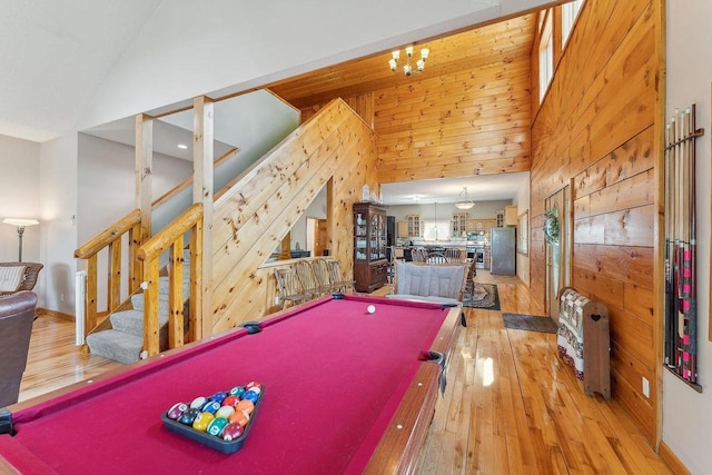 E9510 Oak Hill Rd, Wisconsin Dells, WI 53965 - rec room with wood walls, high vaulted ceiling, billiards table, light wood-style flooring, and a chandelier