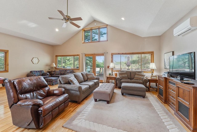 E9510 Oak Hill Rd, Wisconsin Dells, WI 53965 - living room featuring a wall mounted air conditioner, light wood finished floors, ceiling fan, high vaulted ceiling, and recessed lighting