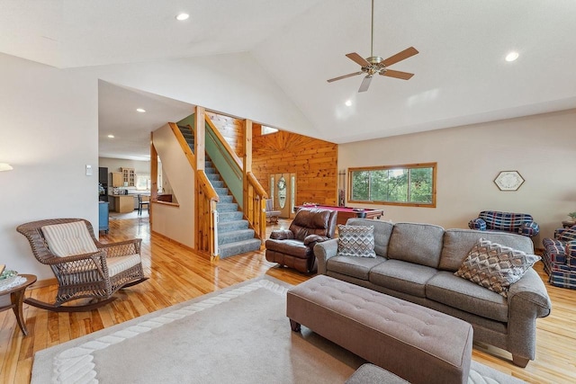E9510 Oak Hill Rd, Wisconsin Dells, WI 53965 - living room featuring stairway, light wood-style floors, a ceiling fan, recessed lighting, and wood walls