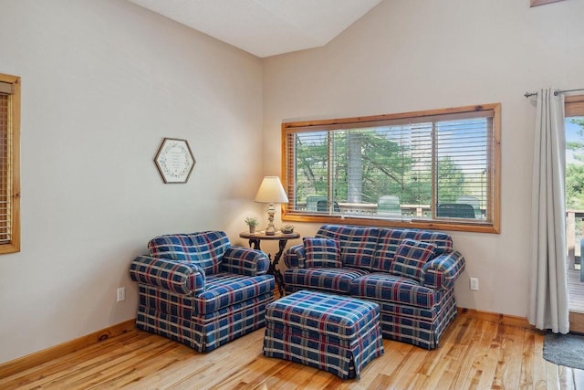 E9510 Oak Hill Rd, Wisconsin Dells, WI 53965 - sitting room with wood finished floors and lofted ceiling