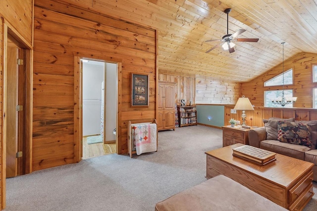 E9510 Oak Hill Rd, Wisconsin Dells, WI 53965 - living area with light carpet, ceiling fan, vaulted ceiling, wooden ceiling, and wood walls