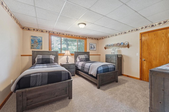 E9510 Oak Hill Rd, Wisconsin Dells, WI 53965 - carpeted bedroom featuring baseboards and a paneled ceiling
