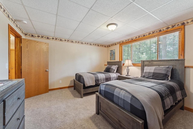E9510 Oak Hill Rd, Wisconsin Dells, WI 53965 - bedroom with light carpet, a paneled ceiling, and baseboards