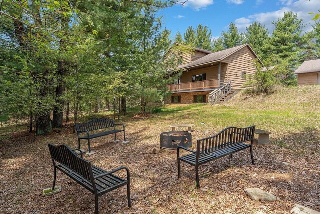 E9510 Oak Hill Rd, Wisconsin Dells, WI 53965 - view of home's community with a fire pit and stairway