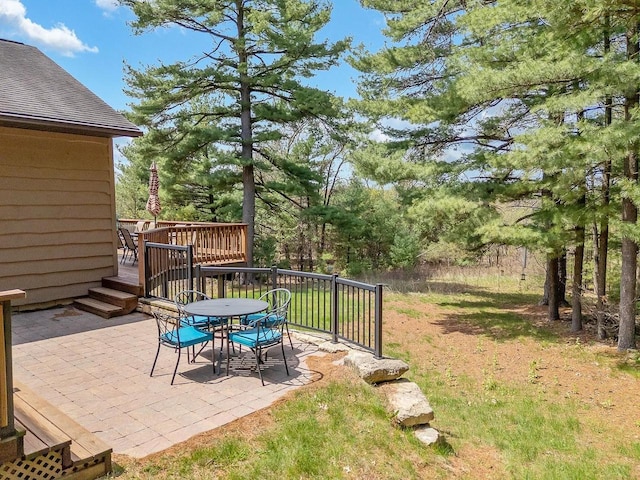 E9510 Oak Hill Rd, Wisconsin Dells, WI 53965 - view of patio / terrace with a wooden deck and outdoor dining area