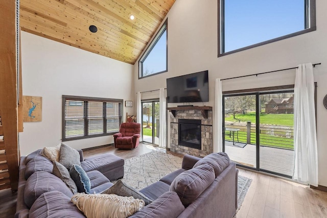 S952 W Redstone Dr, La Valle, WI 53941 - living area featuring high vaulted ceiling, a fireplace, wooden ceiling, and light wood-style floors