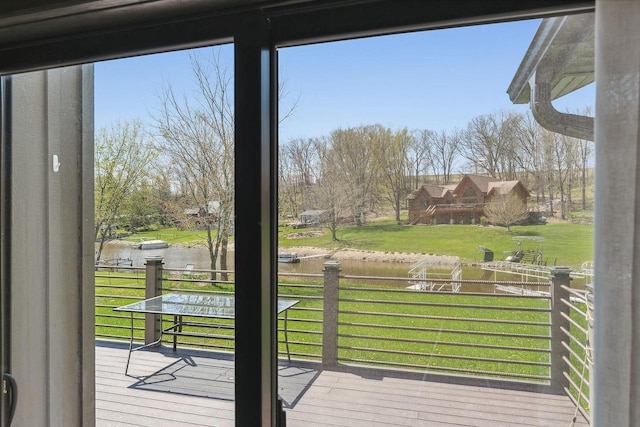 S952 W Redstone Dr, La Valle, WI 53941 - doorway to outside with a water view and view of wooded area