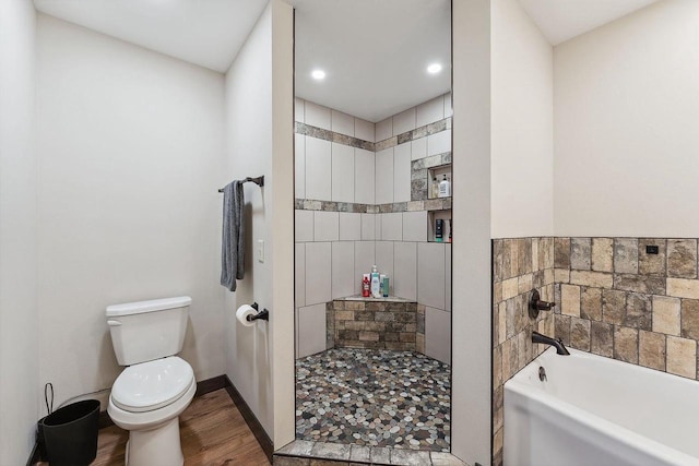S952 W Redstone Dr, La Valle, WI 53941 - bathroom featuring wood finished floors, toilet, a garden tub, a tile shower, and recessed lighting