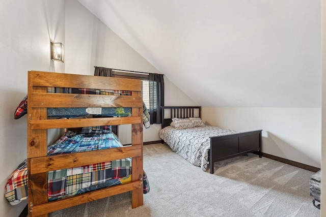 S952 W Redstone Dr, La Valle, WI 53941 - bedroom featuring lofted ceiling, carpet flooring, and baseboards