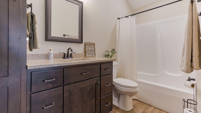 S952 W Redstone Dr, La Valle, WI 53941 - bathroom featuring toilet, wood finished floors, vanity, and shower / tub combo
