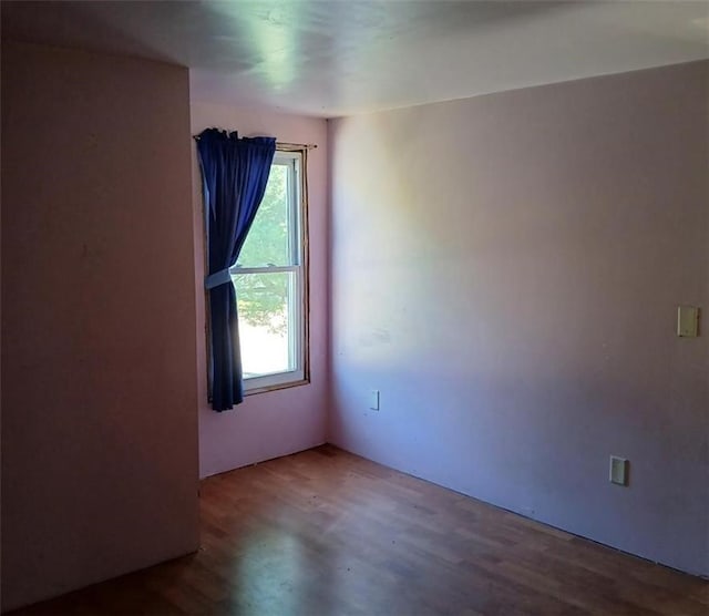 N34855 County Rd S, Blair, WI 54616 - unfurnished room with wood finished floors and plenty of natural light