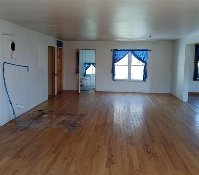 N34855 County Rd S, Blair, WI 54616 - unfurnished living room featuring hardwood / wood-style floors