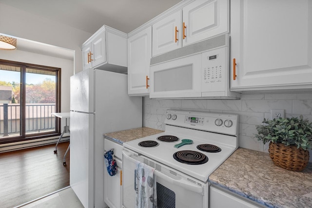 kitchen with white appliances, white cabinets, decorative backsplash, and a baseboard radiator