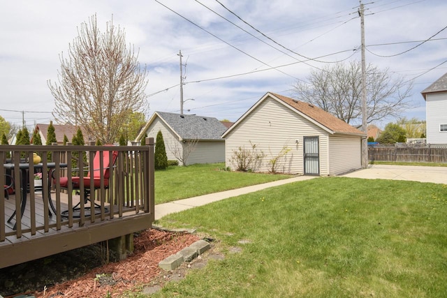 view of yard featuring a deck and an outbuilding