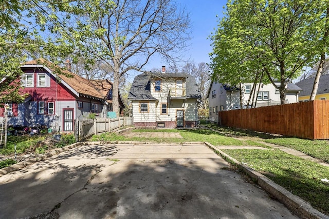 2535 N 48th St, Milwaukee, WI 53210 - rear view of house with a chimney