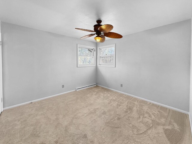 4538 Oakdale Dr, Racine, WI 53405 - carpeted spare room with ceiling fan, baseboard heating, and baseboards
