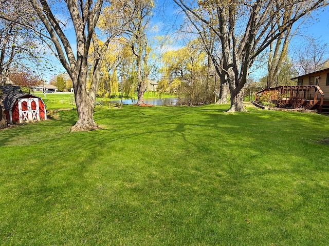 4538 Oakdale Dr, Racine, WI 53405 - view of green lawn featuring a deck with water view