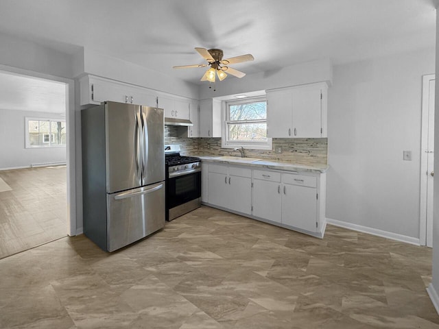 4538 Oakdale Dr, Racine, WI 53405 - kitchen with stainless steel appliances, a sink, light countertops, tasteful backsplash, and a ceiling fan