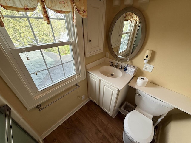 1263 N Parker Dr, Janesville, WI 53545 - half bath featuring wood finished floors, toilet, and healthy amount of natural light