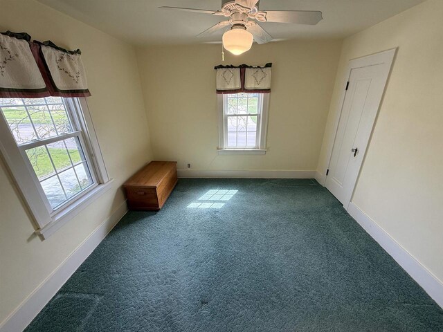 1263 N Parker Dr, Janesville, WI 53545 - empty room featuring carpet, baseboards, and a ceiling fan