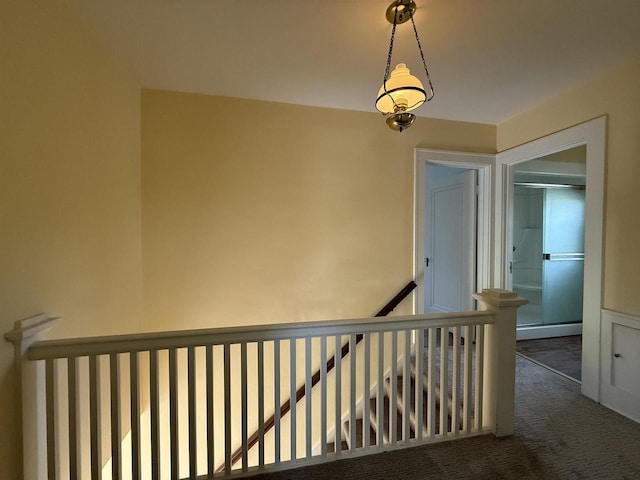 1263 N Parker Dr, Janesville, WI 53545 - corridor with carpet and an upstairs landing