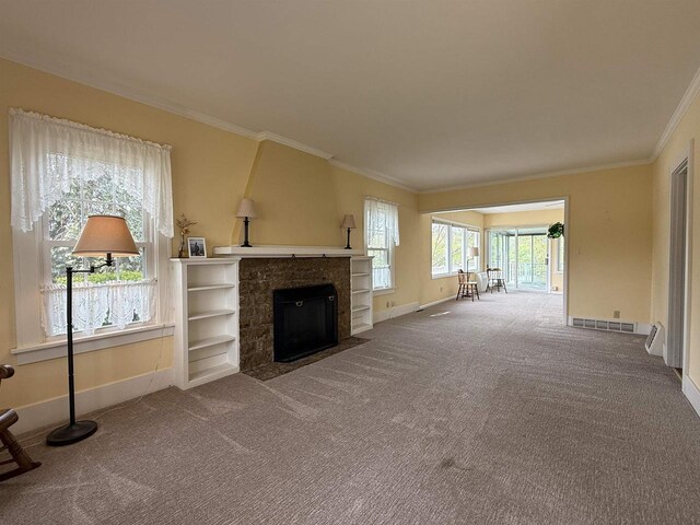 1263 N Parker Dr, Janesville, WI 53545 - unfurnished living room with baseboards, carpet floors, a fireplace, and crown molding