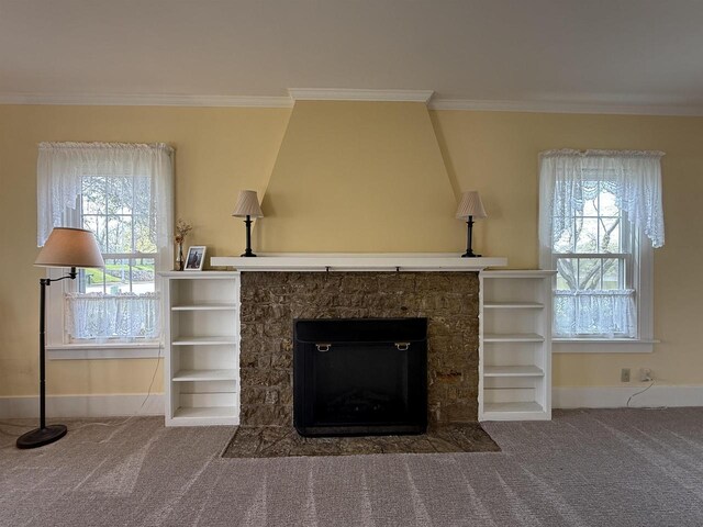 1263 N Parker Dr, Janesville, WI 53545 - detailed view of baseboards, a stone fireplace, carpet, and crown molding