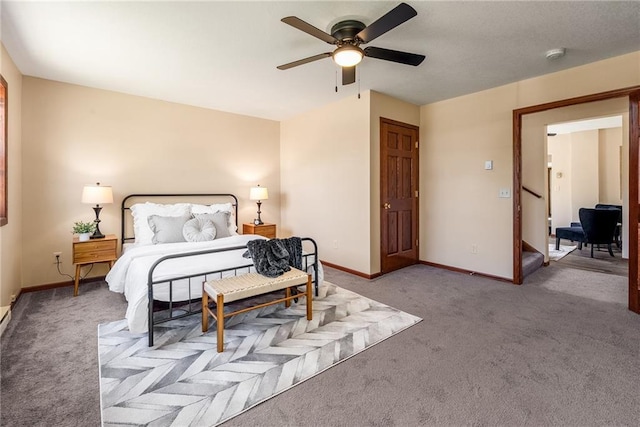 bedroom with carpet flooring, baseboards, and a ceiling fan