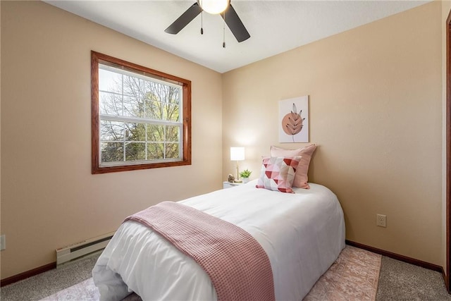 carpeted bedroom featuring a baseboard radiator, baseboards, and a ceiling fan