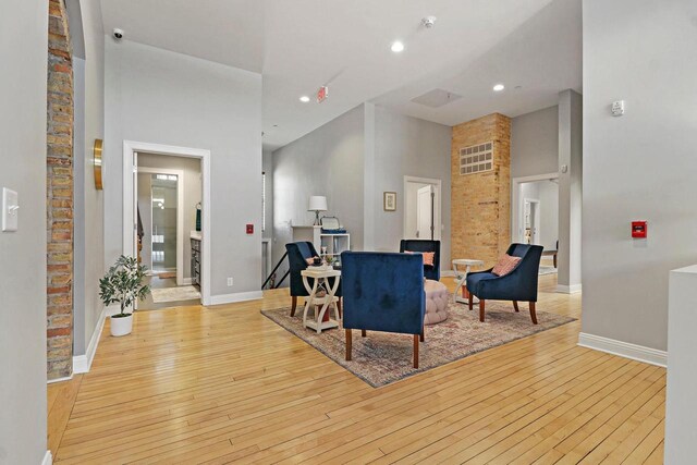 9302 39th Ave, Pleasant Prairie, WI 53158 - living room featuring a high ceiling, wood-type flooring, baseboards, and recessed lighting