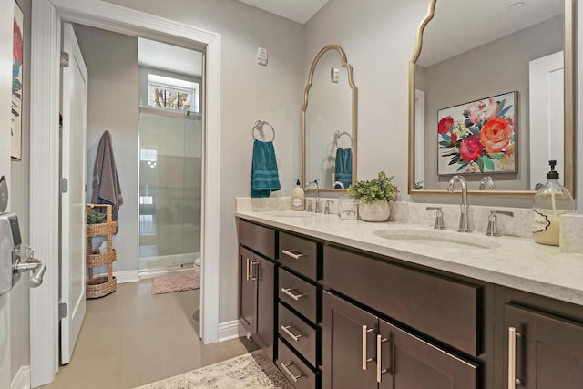 9302 39th Ave, Pleasant Prairie, WI 53158 - bathroom featuring a stall shower, double vanity, and baseboards