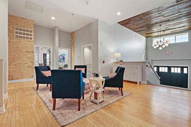 9302 39th Ave, Pleasant Prairie, WI 53158 - living room with a towering ceiling, wood-type flooring, a chandelier, baseboards, and recessed lighting
