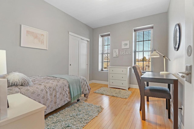 9302 39th Ave, Pleasant Prairie, WI 53158 - bedroom featuring light wood finished floors, baseboards, and a closet