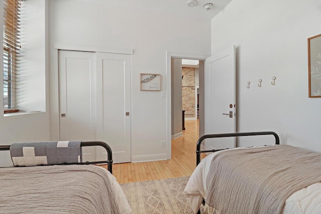 9302 39th Ave, Pleasant Prairie, WI 53158 - bedroom with wood finished floors, a closet, and baseboards