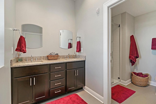 9302 39th Ave, Pleasant Prairie, WI 53158 - full bathroom with a stall shower, double vanity, and baseboards