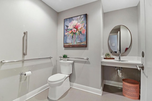 9302 39th Ave, Pleasant Prairie, WI 53158 - half bathroom featuring baseboards, toilet, and a sink