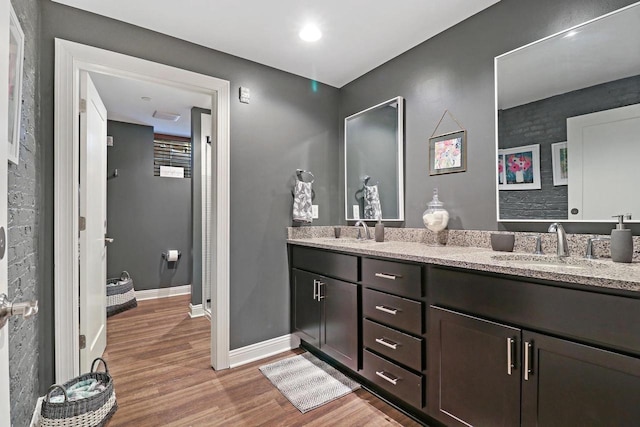 9302 39th Ave, Pleasant Prairie, WI 53158 - bathroom with wood finished floors, baseboards, and double vanity