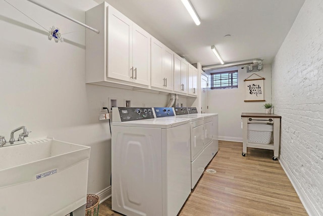 9302 39th Ave, Pleasant Prairie, WI 53158 - washroom featuring cabinet space, washer and dryer, and light wood-style flooring