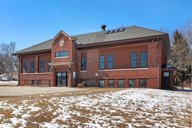 9302 39th Ave, Pleasant Prairie, WI 53158 - snow covered house featuring brick siding and a shingled roof