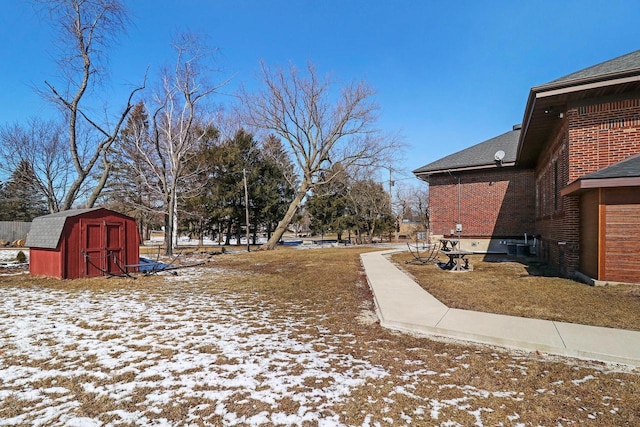 9302 39th Ave, Pleasant Prairie, WI 53158 - yard covered in snow with a storage unit and an outbuilding