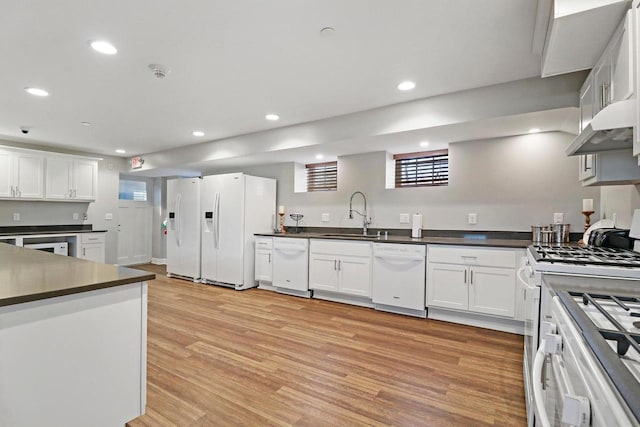 9302 39th Ave, Pleasant Prairie, WI 53158 - kitchen featuring white appliances, a sink, dark countertops, light wood finished floors, and recessed lighting