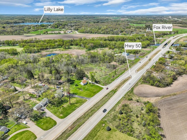 aerial view of a nearby body of water and a highway