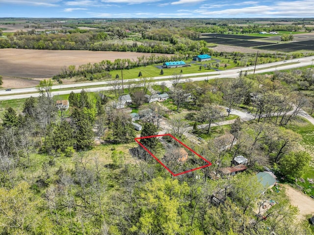 aerial view of property and surrounding area featuring property boundaries highlighted