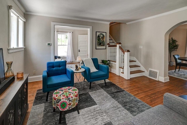 3112 Monroe St, Madison, WI 53711 - living area featuring arched walkways, wood finished floors, ornamental molding, stairway, and baseboards