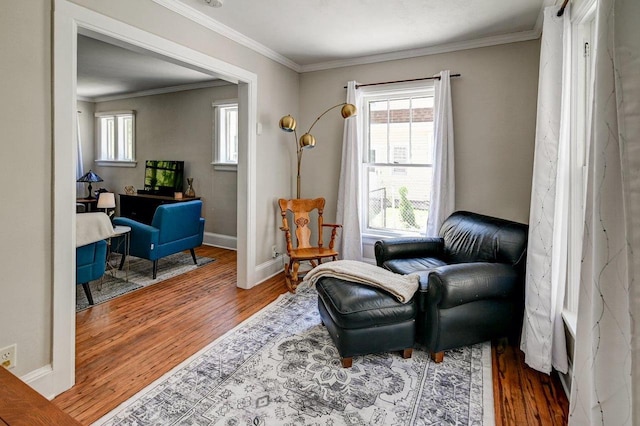 3112 Monroe St, Madison, WI 53711 - living area featuring wood finished floors, healthy amount of natural light, crown molding, and baseboards