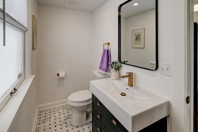 3112 Monroe St, Madison, WI 53711 - bathroom featuring toilet, baseboards, vanity, and recessed lighting