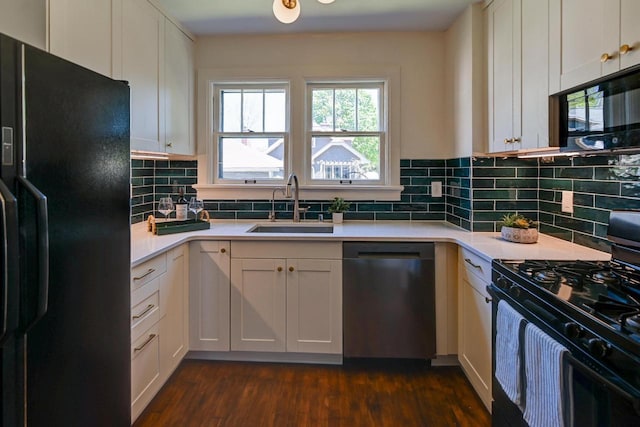 3112 Monroe St, Madison, WI 53711 - kitchen featuring black appliances, a sink, light countertops, and dark wood-type flooring