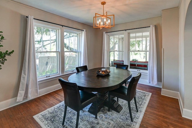 3112 Monroe St, Madison, WI 53711 - dining room featuring a chandelier, baseboards, and healthy amount of natural light