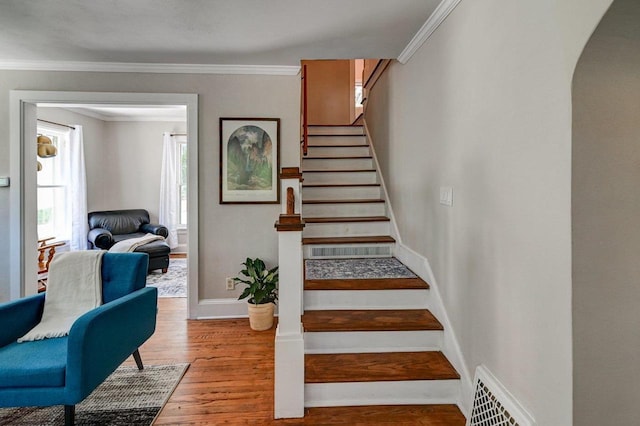 3112 Monroe St, Madison, WI 53711 - stairs featuring baseboards, wood finished floors, ornamental molding, and arched walkways