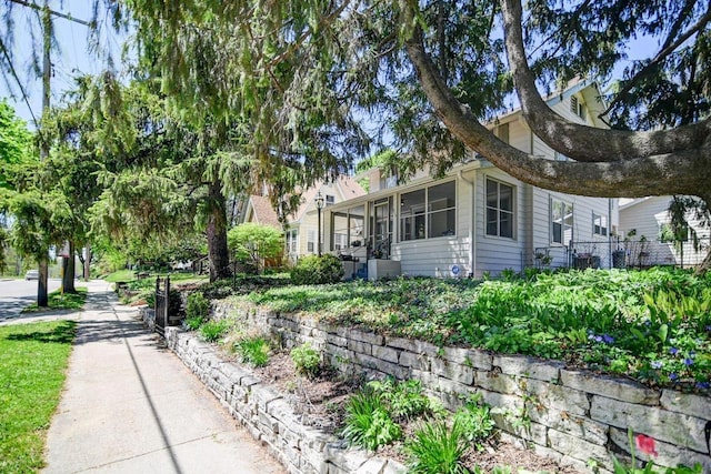 3112 Monroe St, Madison, WI 53711 - view of home's exterior with a sunroom and central AC unit